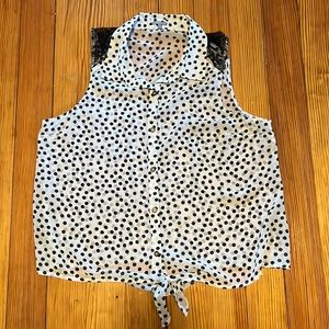 Sleeveless sheer button down top. Black and white polka dots.